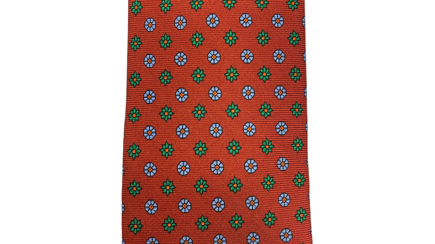 Cravatta seta rossa con fiori verdi e celesti